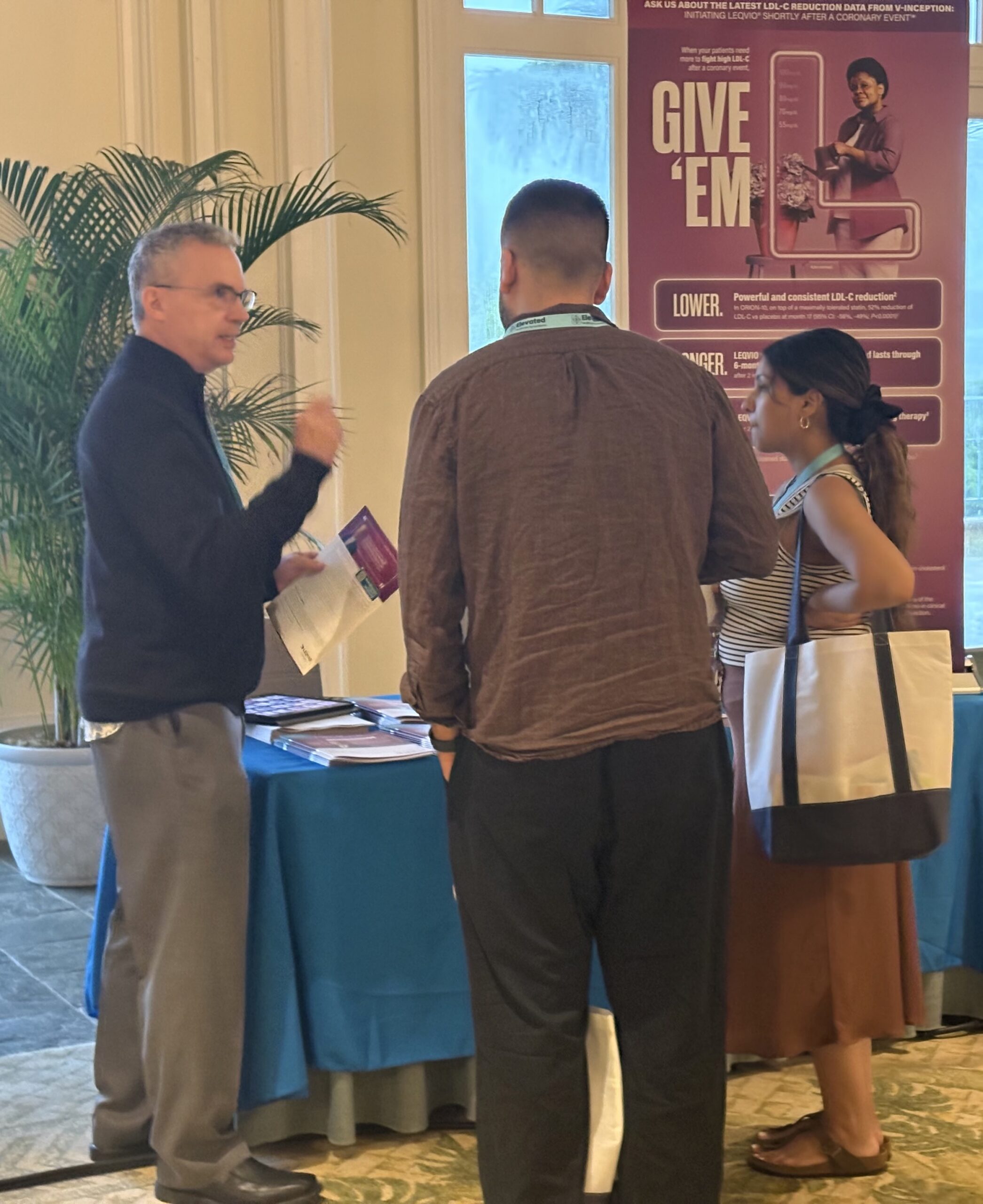 Industry partners engaging with symposium attendees